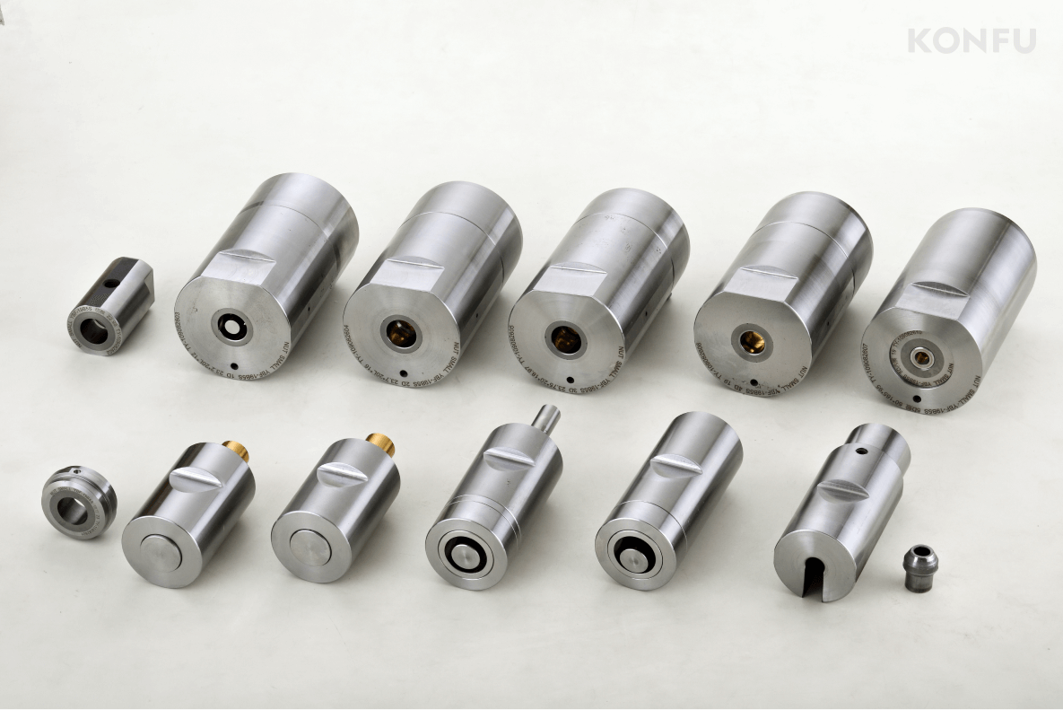 A complete showcase of KONFU's 5 Die 5 Blow forming tools, displaying a full set of metal components for industrial applications.