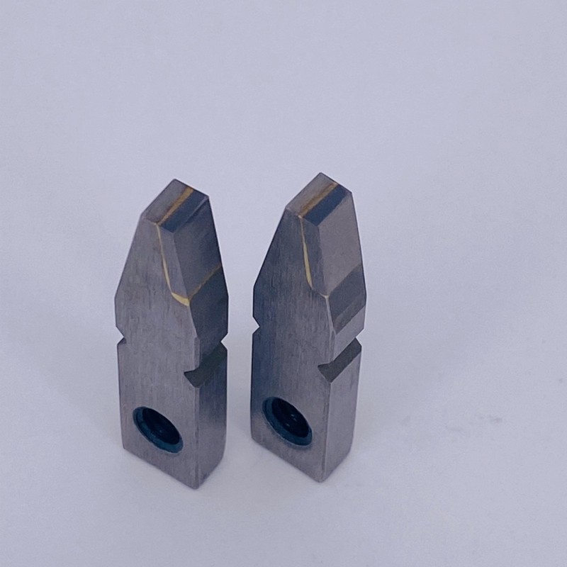 Two different designs of metal cutting tool inserts for versatile manufacturing processes.