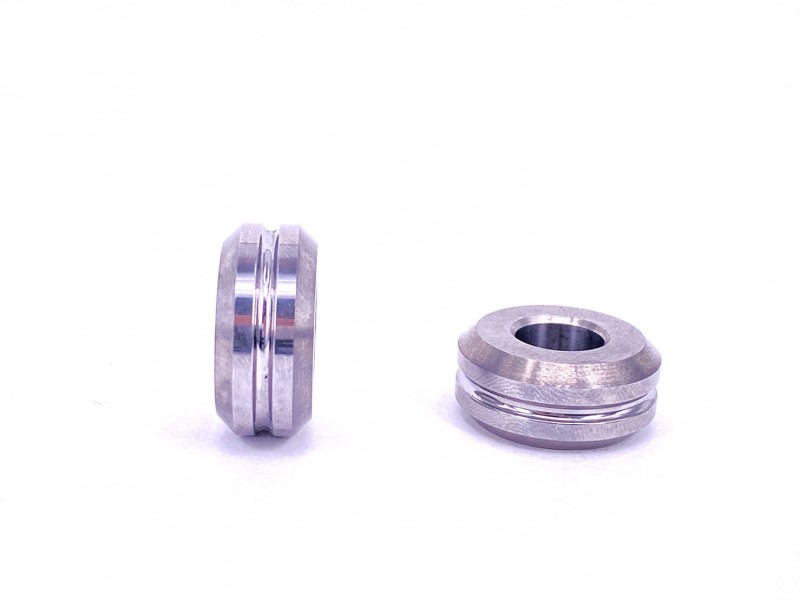 Detailed view of two tungsten carbide roller components for industrial machinery